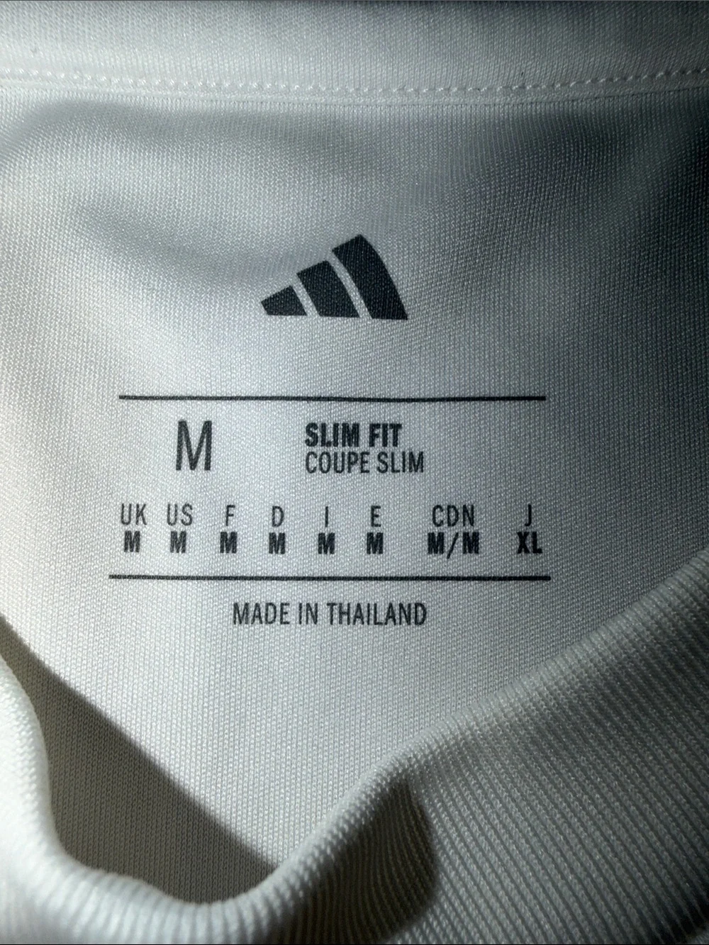adidas White Real Madrid Kids Jersey with Navy Logos and Orange Piping